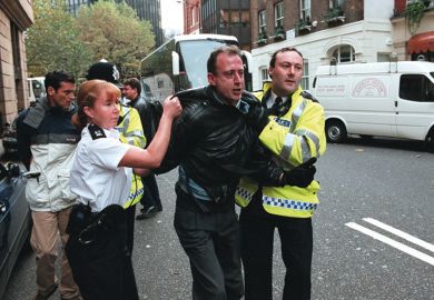 Peter Tatchell is arrested in London for protesting against Robert Mugabe