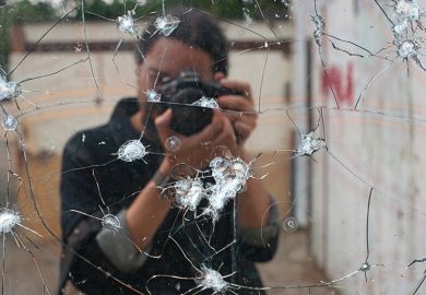 Photo of bullet holes in mirror