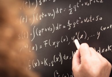 Physics teacher writing Physics teacher writing