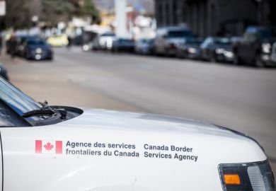 Picture of the logo of Canada Border Services Agency on one of their cars in the port of Montreal. Also known as agence des services frontaliers du canada, or CBSA, it is a federal agency that is responsible for border enforcement, immigration enforcement