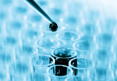 Pipette dripping liquid into test tube