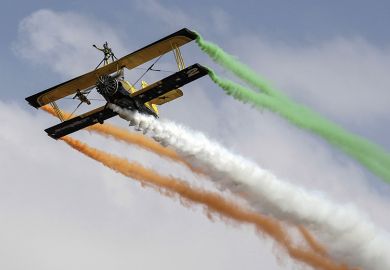 Biplane trailing coloured smoke Biplane trailing coloured smoke