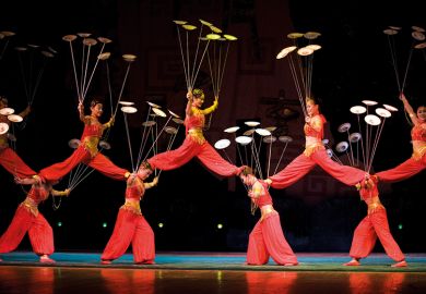Acrobats spinning plates