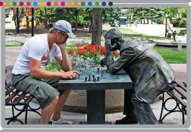 Person playing chess against a statue, illustrating the need to value technical knowledge and soft skills