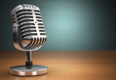 Podcast (old microphone placed on office desk)