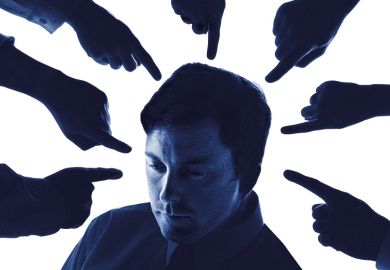 Man surrounding by pointing fingers to illustrate how student evaluations can be detrimental to staff, which could lead to universities facing prosecution.