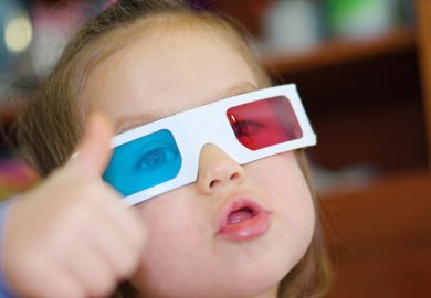 A child wears polarised 3D glasses