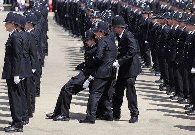 A police officer is caught by colleagues as he becomes faint during a Passing out Parade for the Metropolitan Police. To illustrate how the assessment burden is causing students to wilt A police officer is caught by colleagues as he becomes faint during a Passing out Parade for the Metropolitan Police. To illustrate how the assessment burden is causing students to wilt