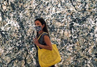 Woman in mask walking past a Pollock painting Woman in mask walking past a Pollock painting