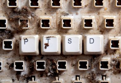 Post-traumatic stress disorder (PTSD) spelled on dirty, broken keyboard keys