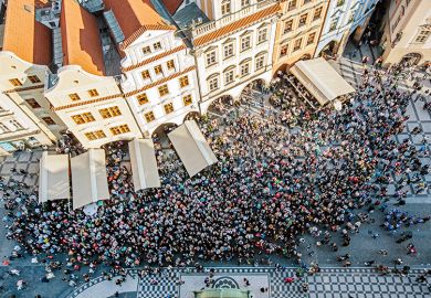 Aerial view of crowd in a square in Prague, Czech Republic to illustrate increasing international student mobility in Europe