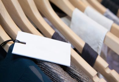 Price label on rack of designer clothes