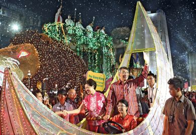 Singapore Prime Minister Lee Hsien Loong waves to a crowd  Singapore Prime Minister Lee Hsien Loong waves to a crowd to illustrate Singapore: second chance society