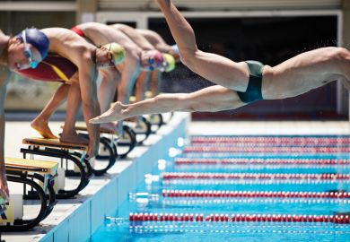 Professional swimmer diving on false start
