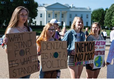 Young women with placards protesting