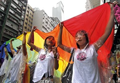 Demonstrators carry a giant rainbow flag in march against homophobia in Hong Kong, 2007