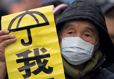 Protestor holding banner, Admiralty District, Hong Kong