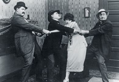 Four people pulling each other