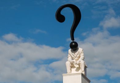 Statue of figure with question mark as head Statue of figure with question mark as head