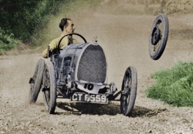 Racecar losing wheel as it turns corner Racecar losing wheel as it turns corner