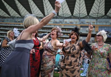 Racegoers celebrate win, Royal Ascot, England Racegoers celebrate win, Royal Ascot, England