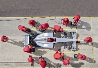 racing team working at pit stop