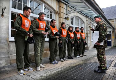 A recruiting officer with a chart of tests for potential recruits at the Army Officer Selection Board at Westbury, Wiltshire UK. To illustrate that universities could conduct more research in partnership with the defence sector