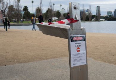 Red tape and warning signs around Albert Park Lake, Melbourne, Victoria, Australia June 06, 2021 Red tape and warning signs around Albert Park Lake, Melbourne, Victoria, Australia June 06, 2021