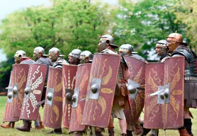 reenactment of Roman legionary during battle
