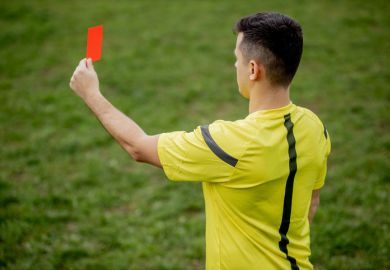 Referee showing a red card Referee showing a red card