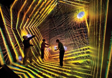 Researchers inside astronomical simulation, Los Alamos National Laboratory