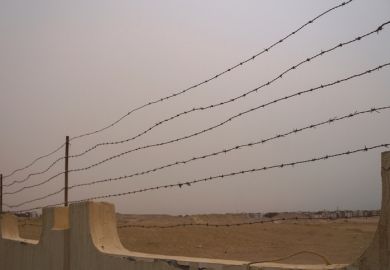 Restrictive fence with barbed wire