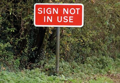 'Sign not in Use' sign on country road 'Sign not in Use' sign on country road