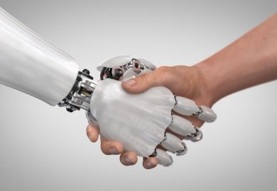 A robot hand shakes a human hand