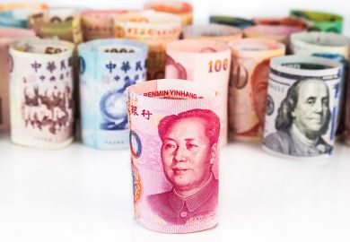 Rolled-up bank notes with Chinese currency at front Rolled-up bank notes with Chinese currency at front