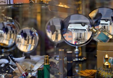 Rome, Italy - February 17, 2022 Reflection in the windows of the small store in Rome, Italy