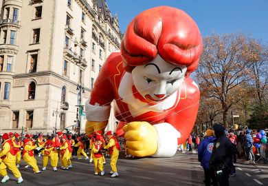 Ronald McDonald balloon hits the ground as it is pulled along Central Park West during the annual Macy's Thanksgiving Day Parade in New York City, Ronald McDonald balloon hits the ground as it is pulled along Central Park West during the annual Macy's Thanksgiving Day Parade in New York City,