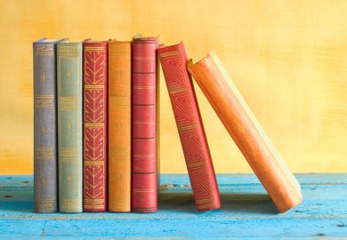 Row of books stacked side-by-side