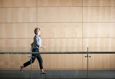 woman running through corridor