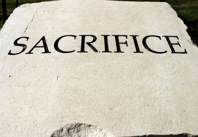 'Sacrifice' engraved on stone tablet 'Sacrifice' engraved on stone tablet