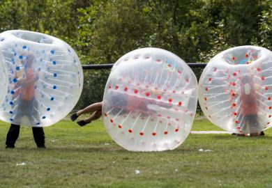 Saint John, New Brunswick, Canada - August 26, 2017 Events at the Dragon Boat Festival. People play bubble soccer. Saint John, New Brunswick, Canada - August 26, 2017 Events at the Dragon Boat Festival. People play bubble soccer.