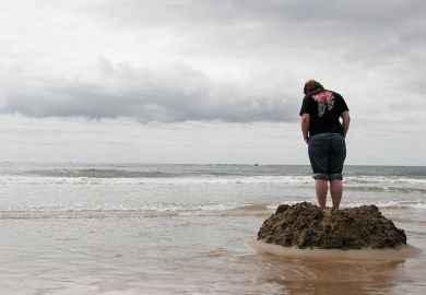 sandcastle with rising tide
