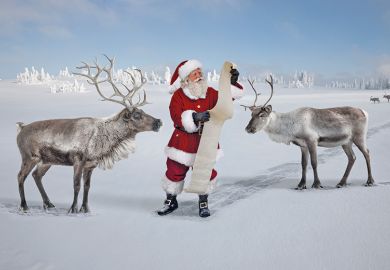 Santa checking list with reindeer