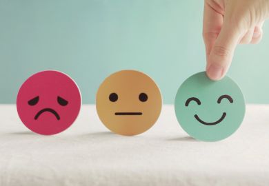 Round discs showing sad, neutral and happy faces Satisfaction