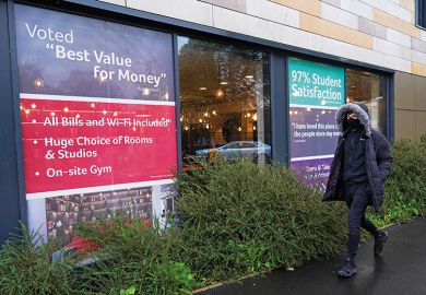 Man walks past office renting student accommodation Man walks past office renting student accommodation illustrating education’s value for money