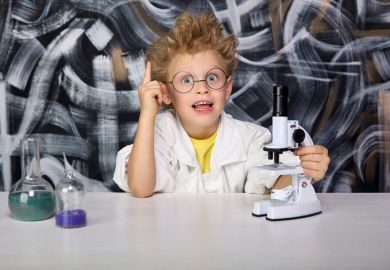 A young boy does a science experiment