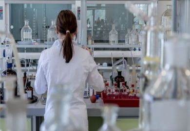 A woman works in a laboratory A woman works in a laboratory