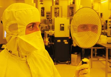 Scientist holding wafer with 667 'Eyescreens', Dresden, 2007 Scientist holding wafer with 667 'Eyescreens', Dresden, 2007