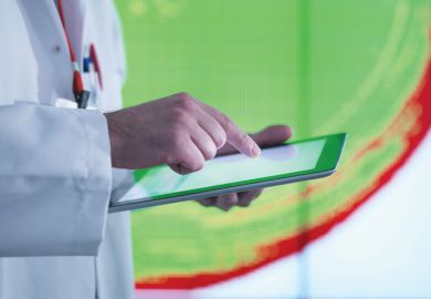 Scientist working with touchscreen tablet device