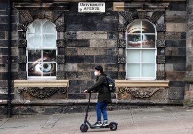 Student on a scooter on campus at the University of Glasgow, with large eyes looking at him through windows. To illustrate the university being placed on a student visa sponsorship “action plan” by the Home Office Student on a scooter on campus at the University of Glasgow, with large eyes looking at him through windows. To illustrate the university being placed on a student visa sponsorship “action plan” by the Home Office